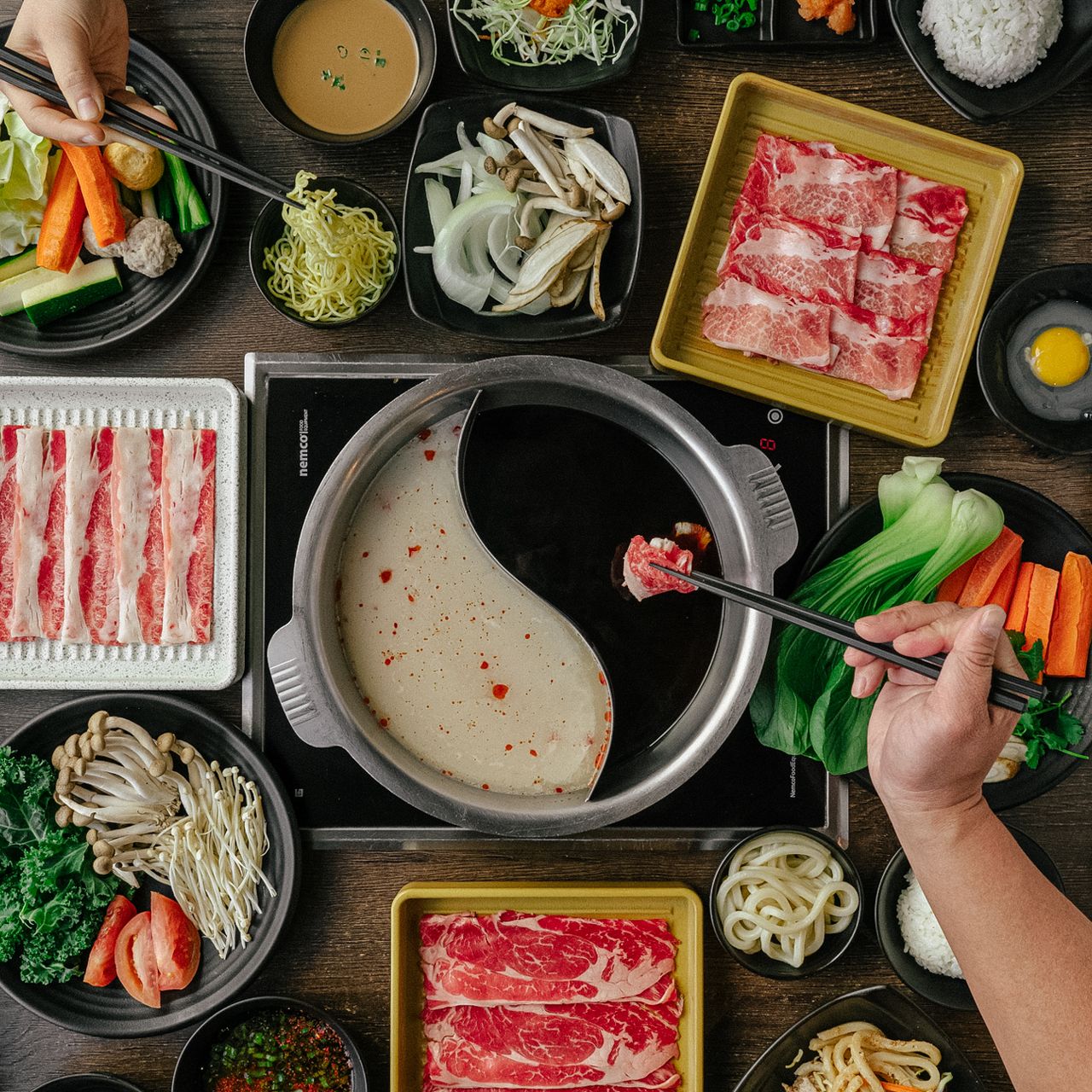 Split pot-one side for Sukiyaki and the other for Shabu Shabu